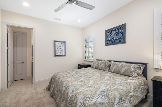 bedroom featuring baseboards, visible vents, a ceiling fan, light colored carpet, and recessed lighting