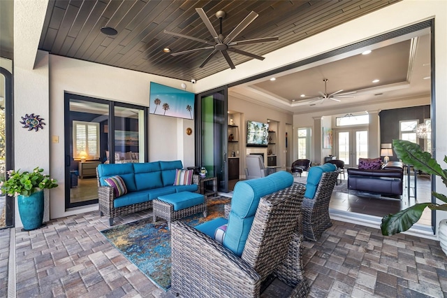 view of patio featuring french doors, outdoor lounge area, and a ceiling fan