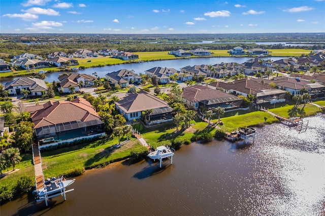 aerial view with a residential view and a water view