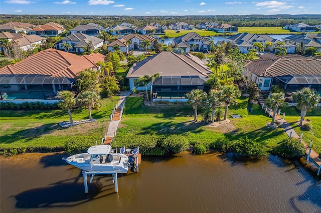 aerial view featuring a water view and a residential view