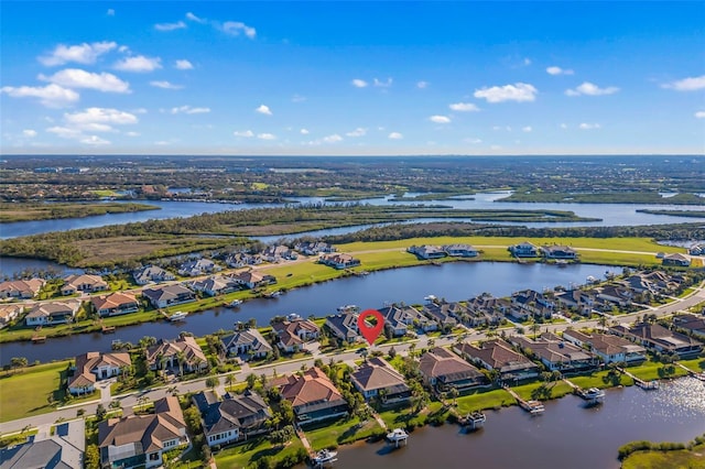 bird's eye view featuring a water view and a residential view