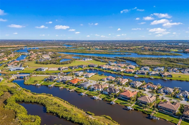 bird's eye view featuring a water view and a residential view