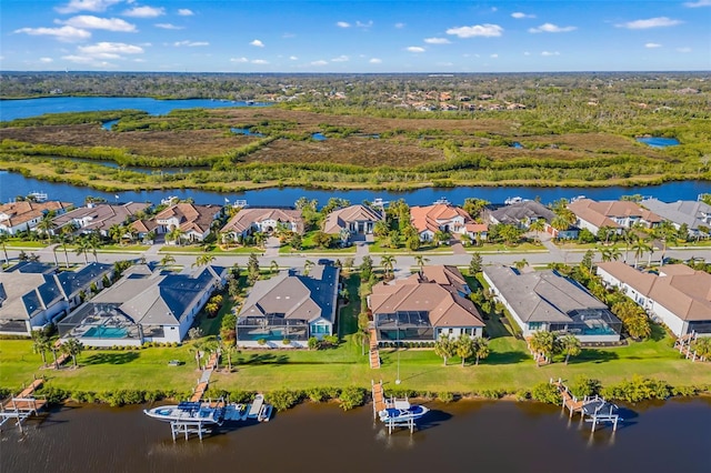 aerial view featuring a water view and a residential view