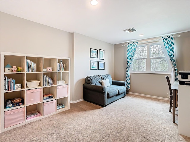 living area with recessed lighting, visible vents, baseboards, and carpet flooring