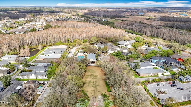 birds eye view of property with a residential view