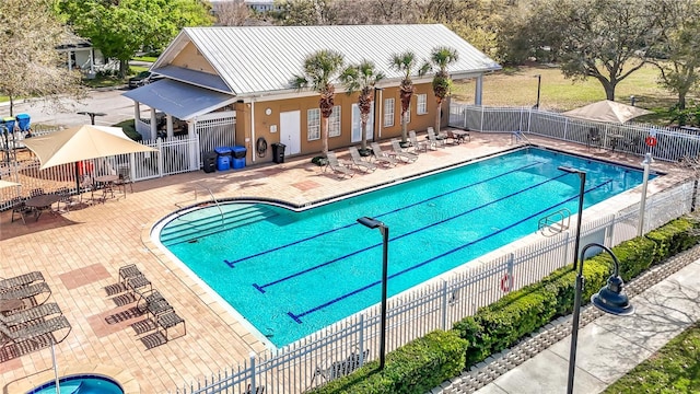 pool featuring a patio and fence