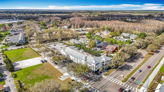 bird's eye view featuring a view of trees and a residential view