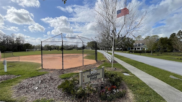 view of property's community featuring a yard