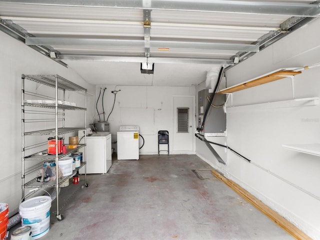 garage featuring washing machine and dryer and a garage door opener