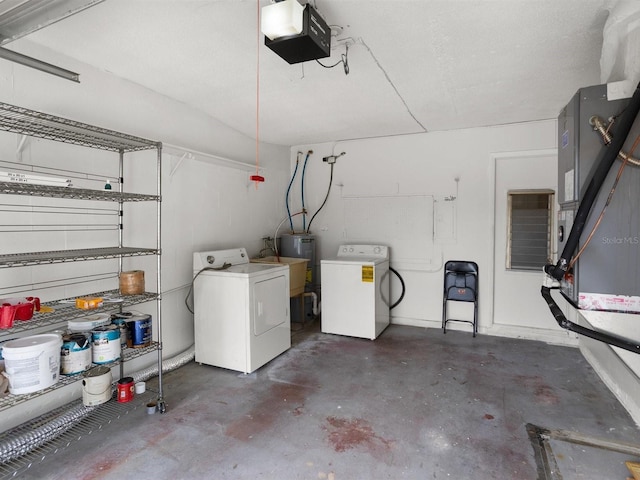 garage featuring washer and clothes dryer, a sink, and a garage door opener