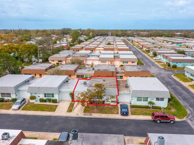 birds eye view of property with a residential view