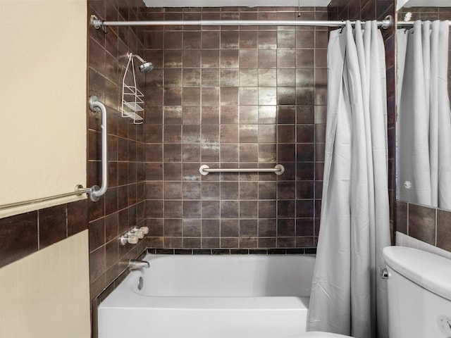 bathroom with toilet and shower / bath combo