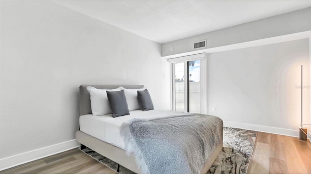 855 Bayway Blvd Unit 105, Clearwater, FL 33767 - bedroom featuring wood finished floors and baseboards