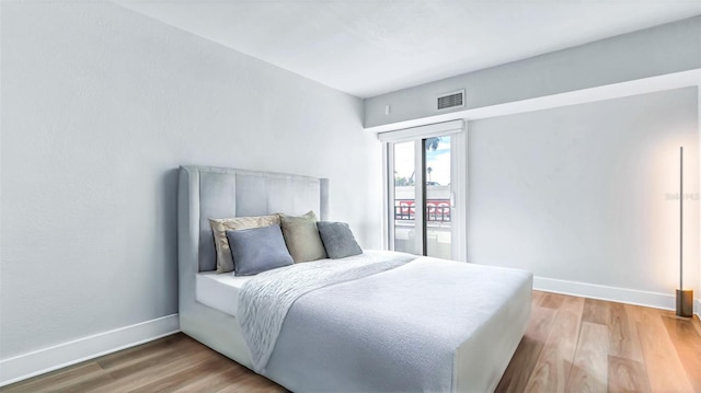 855 Bayway Blvd Unit 105, Clearwater, FL 33767 - bedroom featuring wood finished floors and baseboards