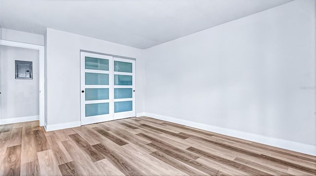 855 Bayway Blvd Unit 105, Clearwater, FL 33767 - unfurnished room featuring wood finished floors and baseboards