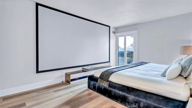 855 Bayway Blvd Unit 105, Clearwater, FL 33767 - bedroom with wood finished floors and baseboards