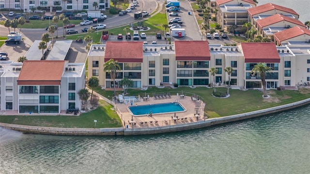 855 Bayway Blvd Unit 105, Clearwater, FL 33767 - drone / aerial view of a pool area and a nearby body of water