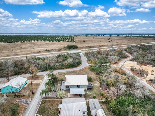 birds eye view of property with a rural view