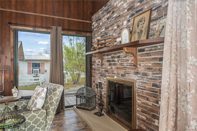 living room with a brick fireplace