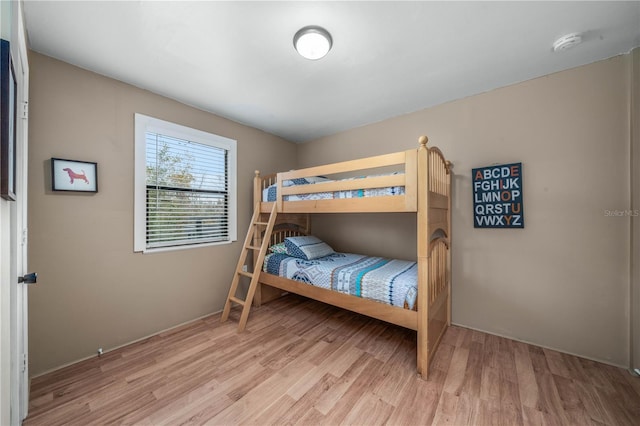 bedroom with light wood-style floors