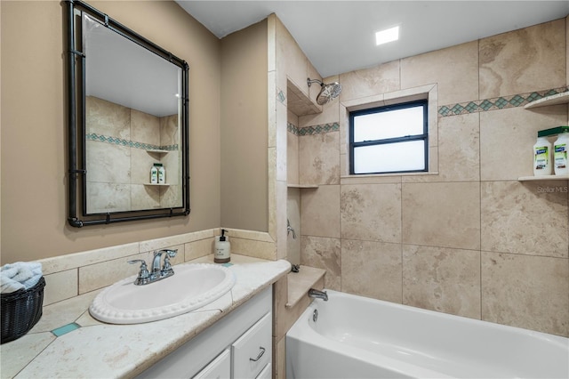 bathroom with washtub / shower combination and vanity