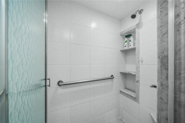 full bathroom featuring a shower stall