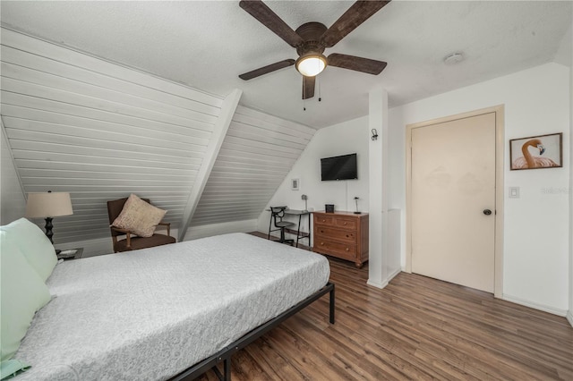 bedroom featuring ceiling fan, baseboards, vaulted ceiling, and wood finished floors