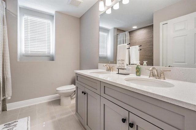 full bath featuring tile patterned flooring, visible vents, a sink, and double vanity