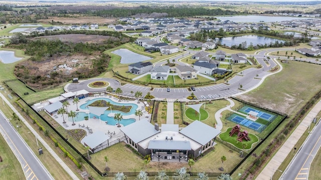 bird's eye view featuring a water view and a residential view