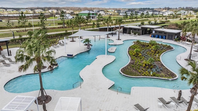 view of swimming pool with a residential view