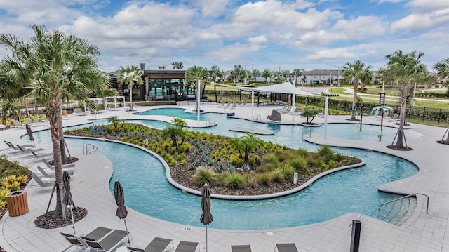 view of swimming pool with fence