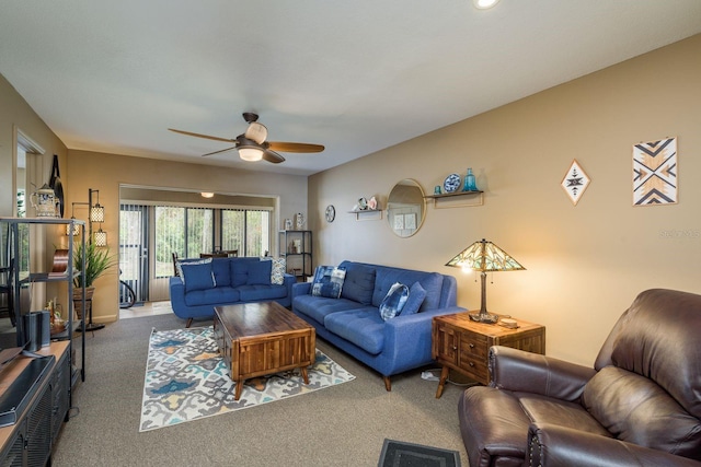 living room with carpet flooring and ceiling fan