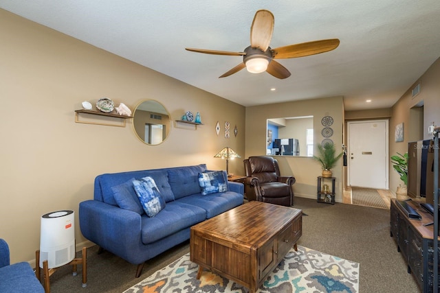 carpeted living area with baseboards, visible vents, a ceiling fan, and recessed lighting