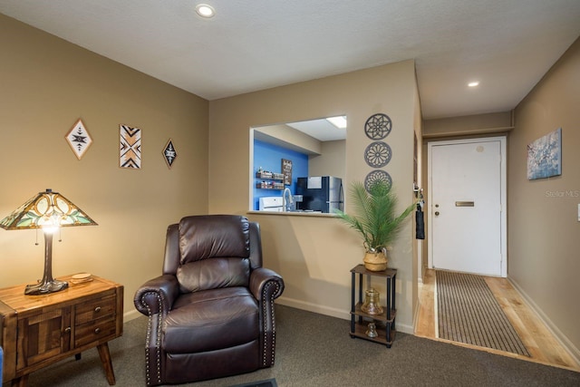 living area featuring carpet floors, recessed lighting, and baseboards