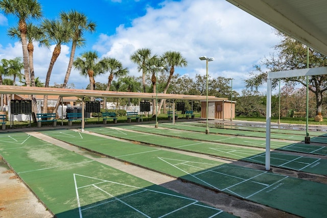 view of home's community featuring shuffleboard