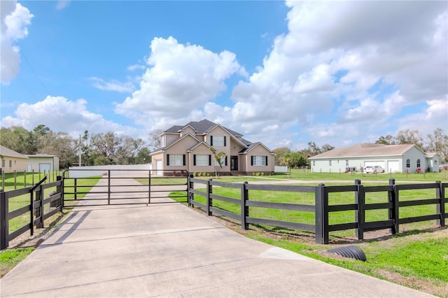 view of gate with a yard and fence