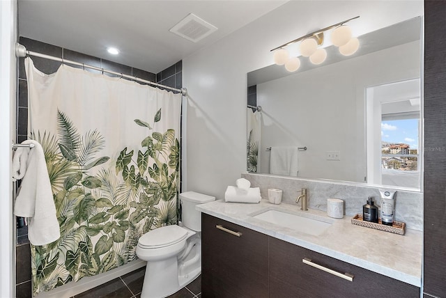 full bathroom featuring toilet, tile patterned flooring, vanity, and visible vents