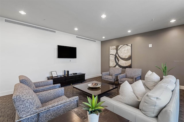 living area featuring visible vents, baseboards, and recessed lighting