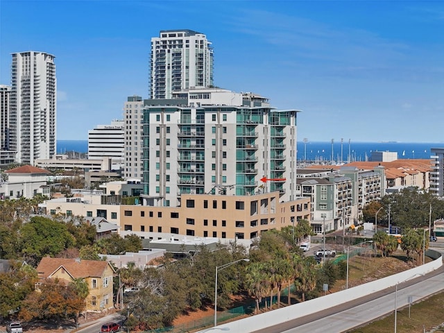 view of property with a view of city and a water view