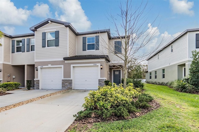 view of property with stucco siding, concrete driveway, a garage, stone siding, and a front lawn