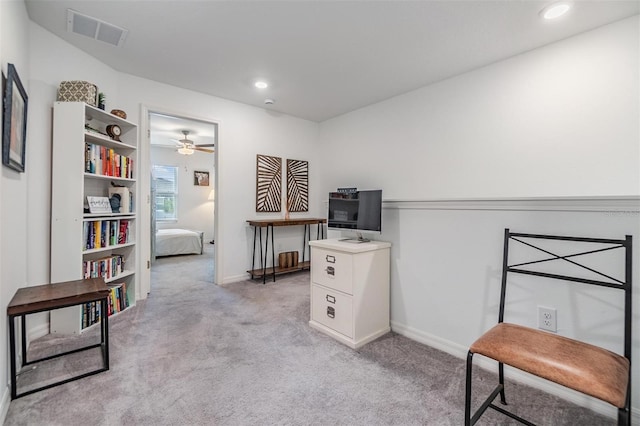office space featuring light colored carpet, visible vents, baseboards, and recessed lighting