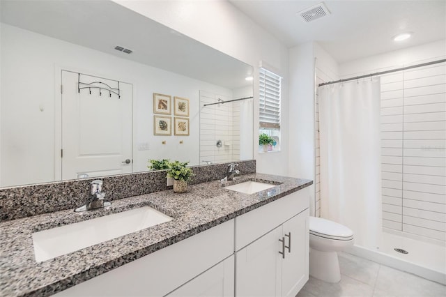 full bath with visible vents, a sink, and double vanity