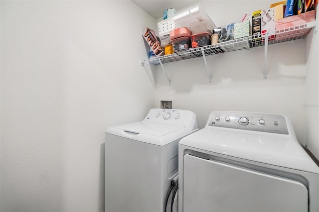 laundry room featuring laundry area and washer and clothes dryer