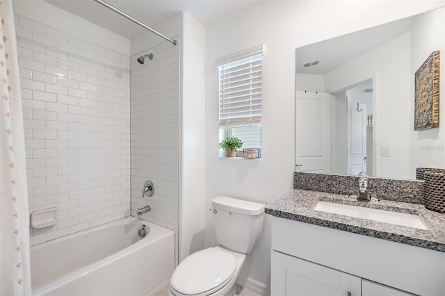 full bathroom with toilet, vanity, visible vents, and bathing tub / shower combination