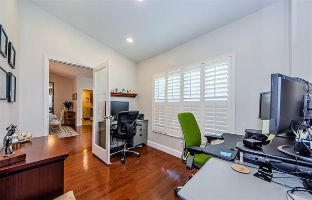 office featuring recessed lighting, baseboards, lofted ceiling, and wood finished floors
