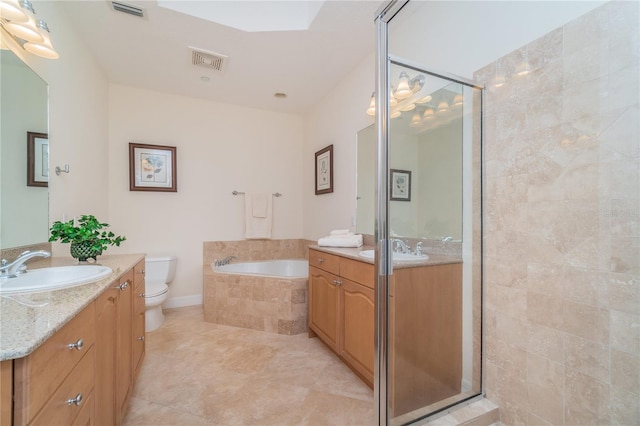 bathroom with toilet, two vanities, a sink, and visible vents