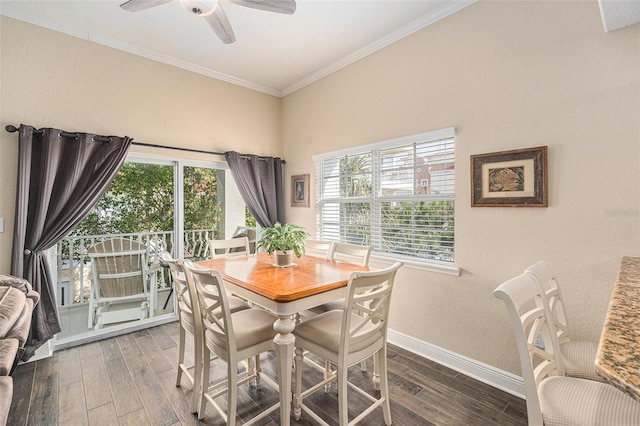 dining area featuring ornamental molding, plenty of natural light, wood finished floors, and baseboards