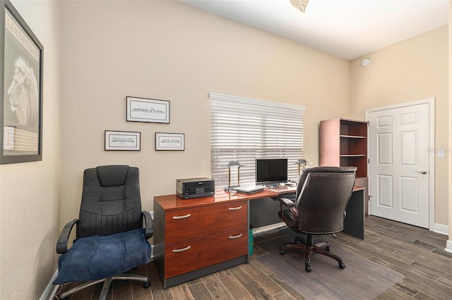 office with dark wood-style floors and baseboards