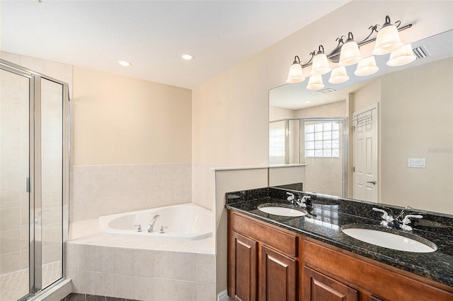 full bath featuring a garden tub, a shower stall, visible vents, and a sink