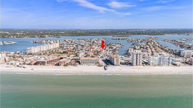 aerial view featuring a water view, a beach view, and a city view